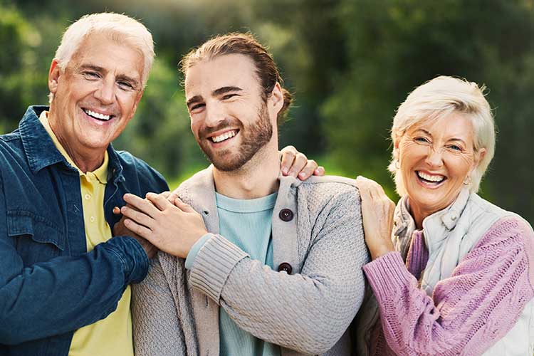 Parents smiling with their son free from addiction.