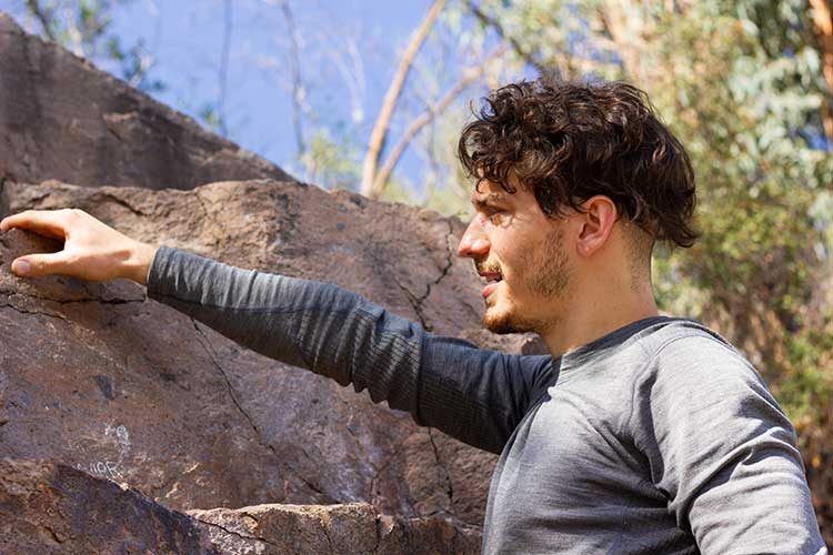 Man standing thinking deeply about wilderness treatment.
