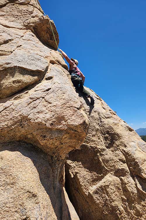 Man Rock climbing while in adventure therapy overcoming a prescription drug addiction in Vista, CA