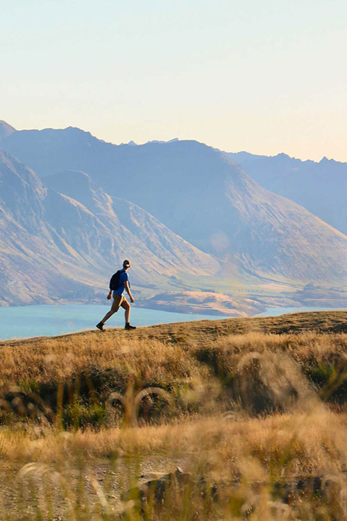 Man hiking looking at vista as part of Sacred Journey's Outdoor Adventure Therapy for addiction recovery in Vista, CA.