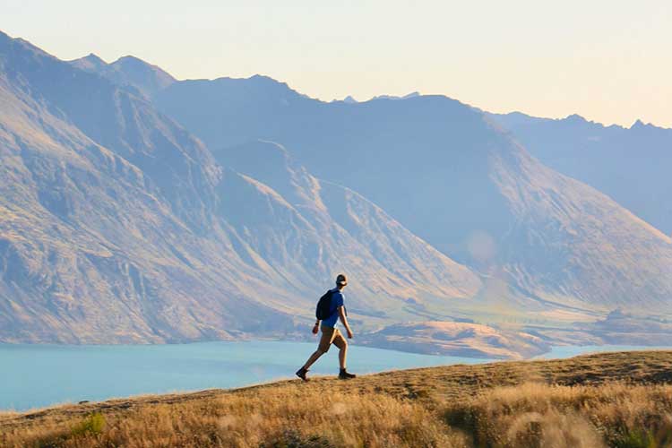 Man hiking looking at vista as part of Sacred Journey's Outdoor Adventure Therapy for addiction recovery in Vista, CA.