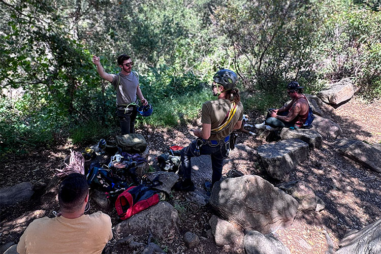 Group of men outside engaged in cognitive behavioral therapy in Vista, CA.