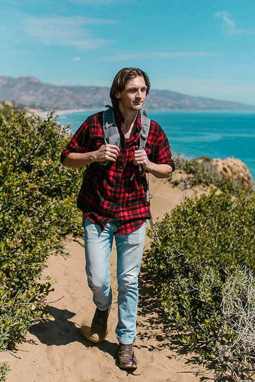 Man hiking in nature experiencing narrative therapy for addiction recovery in Vista, CA.