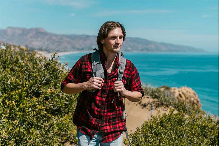 Man hiking in nature experiencing narrative therapy for addiction recovery in Vista, CA.