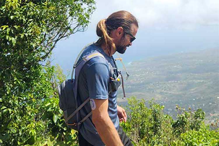 Man on cliff edge having overcome Hydrocodone Addiction Treatment for Men in Vista, CA​.