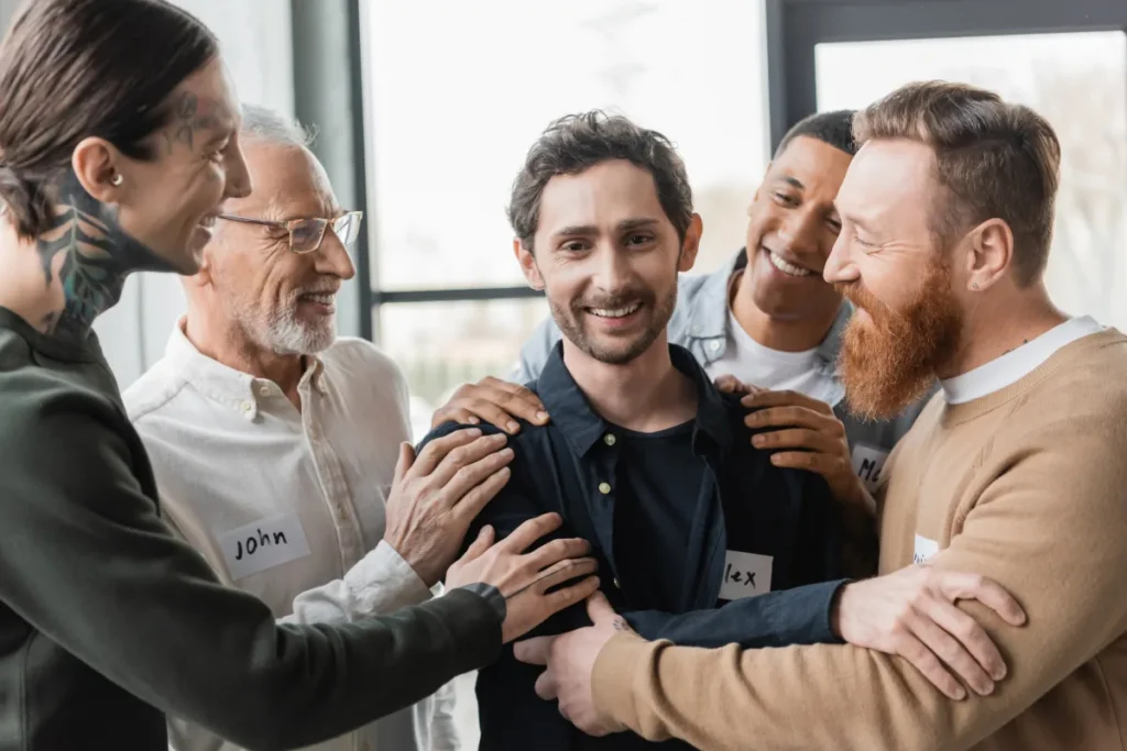Men in a support group circle sharing openly, showing how group accountability strengthens recovery beyond willpower