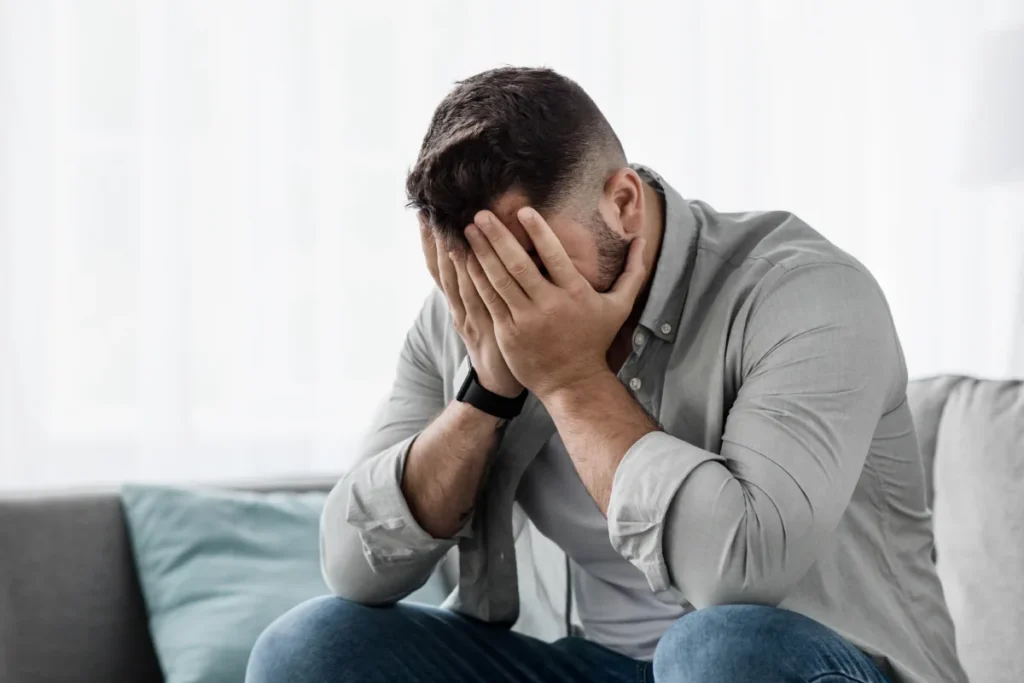 Man mapping out a relapse prevention plan at a desk, building structure to close the planning gap